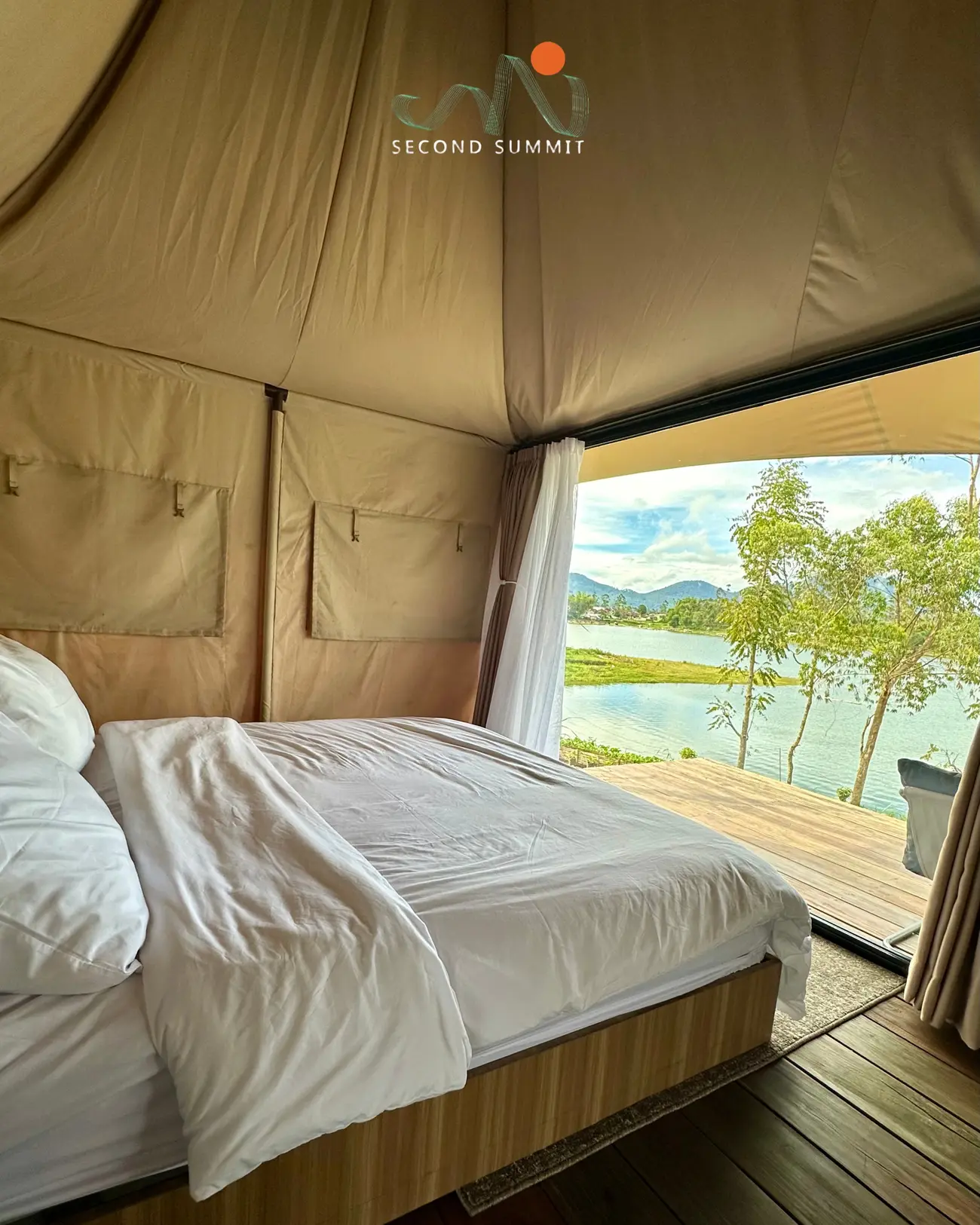 Glamping tent interior with lake view