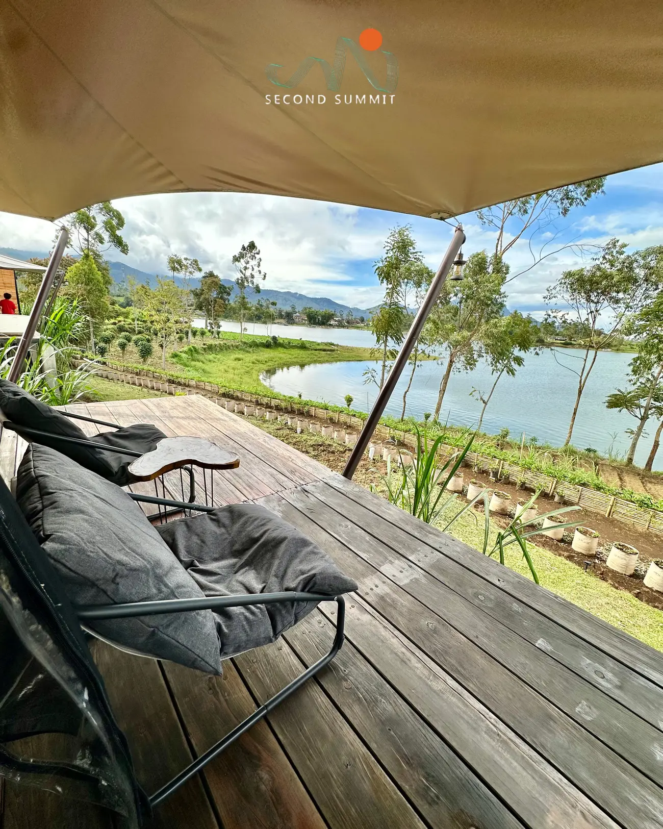 Lounge chairs under the glamping tent awning