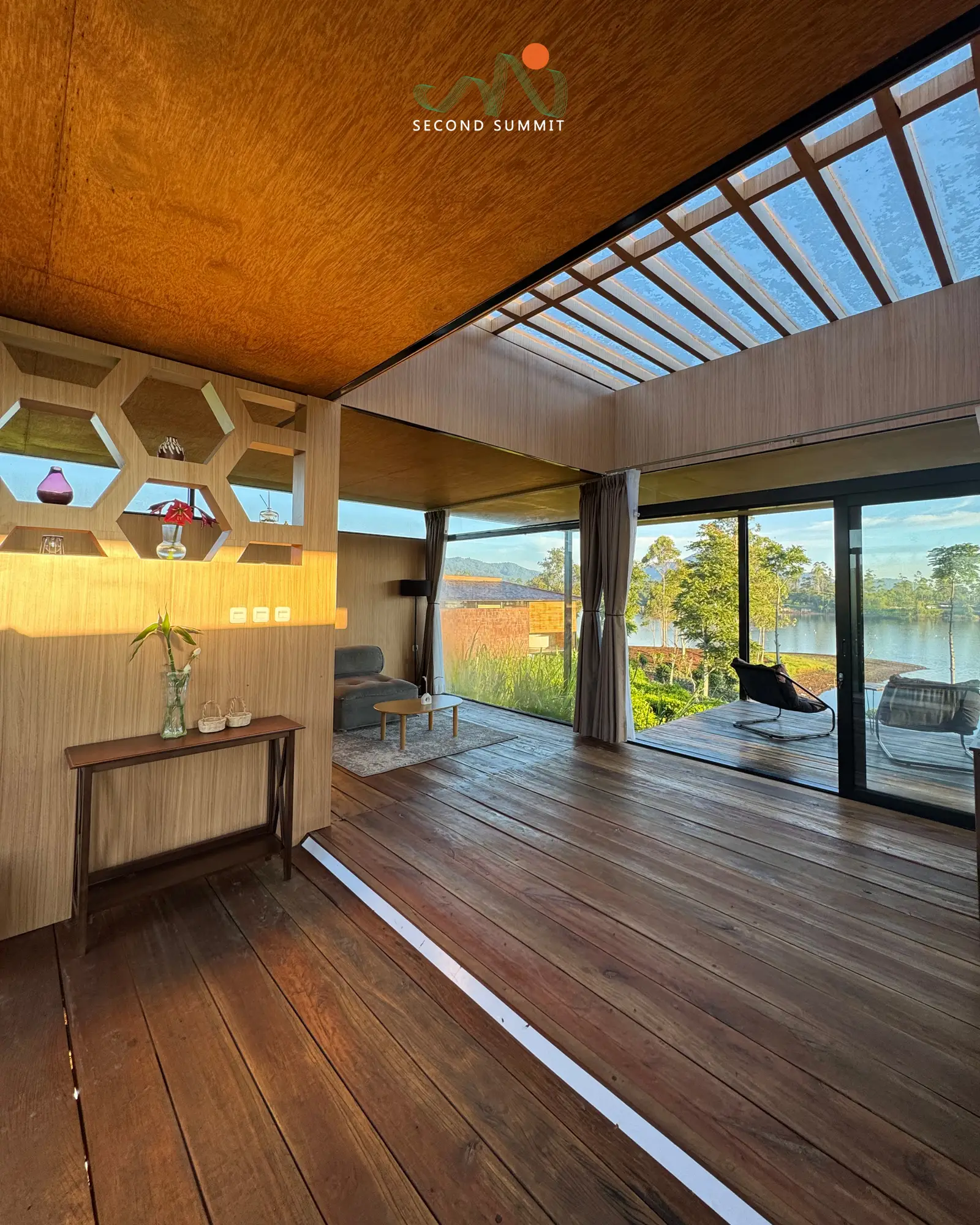 Spacious villa living room opening onto the lake
